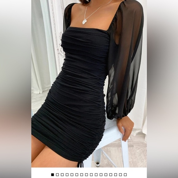 Black bodycon style dress‎ w long sleeved sheer sleeves and ruching on sides - Picture 1 of 7